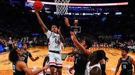 Hawkins, No. 11 UConn hold off Providence 73-66 in Big East